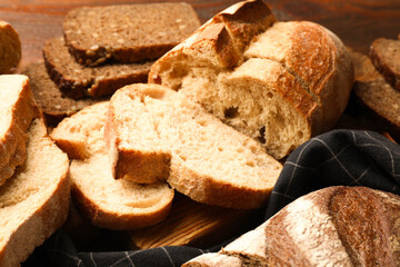 Different types of fresh bread on table, closeup