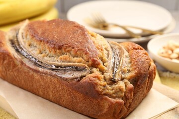 Delicious homemade banana bread on table, closeup