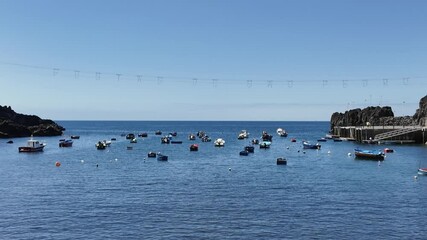 Camara de Lobos, Portugal - June 11, 2024: Boats in bay of Camara de Lobos on Madeira Island, Portugal