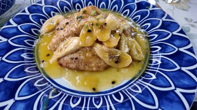 Black scabbardfish with banana and Passion fruit syrup in restaurant on Madeira Island in Portugal
