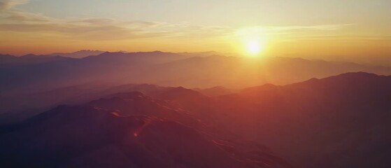Sunrise over mountains landscape, nature scenery with vibrant colors, tranquil atmosphere, outdoor adventure, morning light reflection, scenic view.