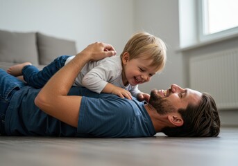 Father and son laughing together while lying on the floor in a bright and airy living room