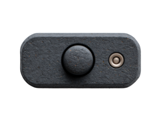 A close up photograph showcases the minimalist design of a small gray o amplifier with a volume knob and jack against a clean white background highlighting simplicity.