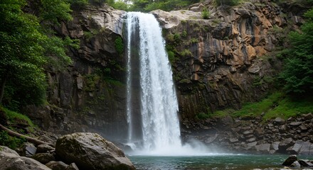 Fototapeta premium Waterfall in Rocky Forest Landscape