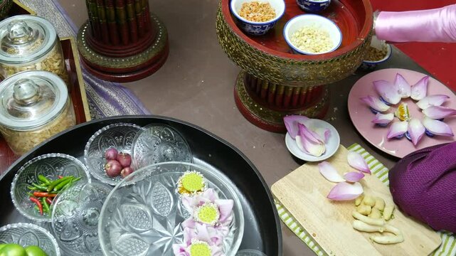 Making Miang Kham (traditional Southeast Asian herbal snack from Thailand and Laos), Traditional Thai snack. It&rsquo;s a snack containing different ingredients of herbs and vegetables. 