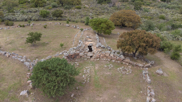 Drone shot of the prehistoric Giants' Tomb of San Cosimo, showcasing its megalithic layout
