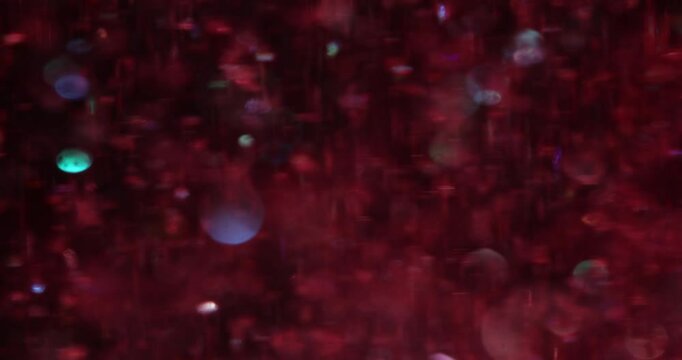 Colorful glitters create beautiful atmosphere with bright red pattern Festive designs and holiday projects with magic shiny sparkles