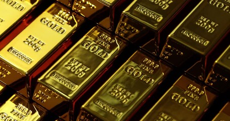 Neatly stacked gold bars create striking display reflecting light. Symbolization of wealth investment and financial security with shiny surfaces