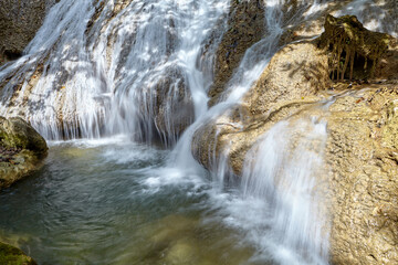 Scenic view of waterfall in tropical rainforest 