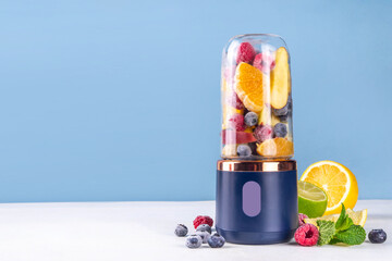 Healthy fruit and berry smoothie drink in portable blender