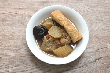boiled slice radish with tofu and black mushroom soup vegetarian food on bowl