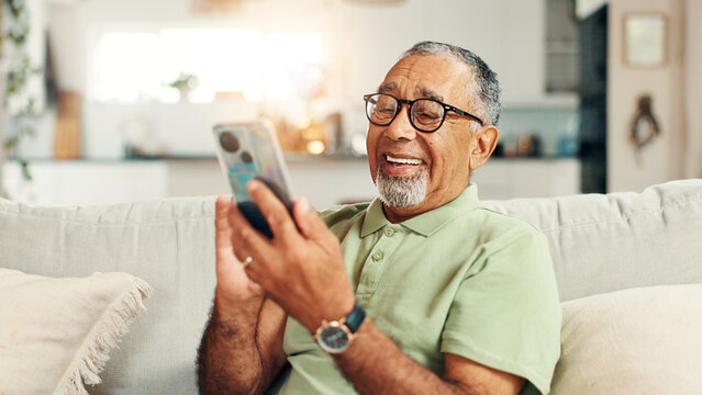 Home, laughing and senior man with smartphone, relax and texting with tech in living room, smile and online. Communication, retirement and elderly person with mobile for chat, message or social media