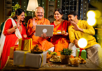Celebrating Diwali and sharing wishes with loved ones using smartphone on a festive evening