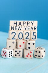2025 Happy New Year banner. Numbers displayed on white dice stacked on wooden cubes against a blue background.