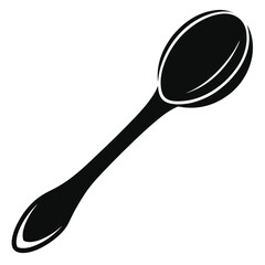 Simple black spoon sits diagonally isolated on the white backdrop displaying cooking and kitchenware