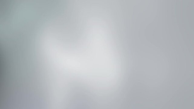 Blurry white and grey gradient background. Perfect for adding subtle texture and depth to presentations, websites, social media graphics, and print materials.