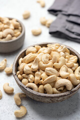 Cashew nuts in bowl closeup view, healthy vegan snack food