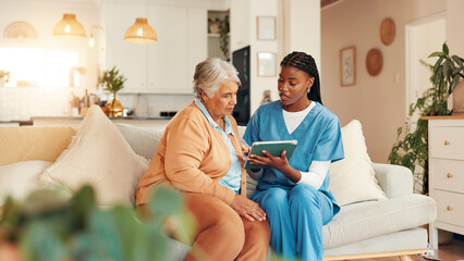 Tablet, consultation and senior woman with nurse for medical discussion on sofa in home. Technology, conversation and caregiver explain with elderly patient, diagnosis and assisted living at house