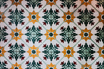 Colorful and symmetrical floral pattern Peranakan vintage floor tiles inside a heritage mansion in...