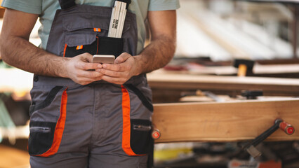 Young carpenter working in his workshop
