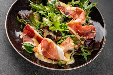 Salad jamon meat green leaf lettuce appetizer natural food fresh delicious gourmet food background on the table rustic food top view copy space keto and paleo diet