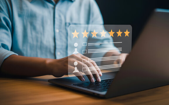 Person using laptop to provide customer feedback and evaluate service quality with online survey
