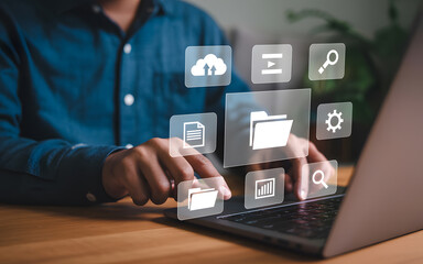 Naklejka premium Person using laptop with cloud storage and data management icons representing digital technology