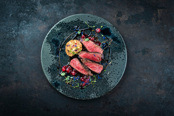 Traditionally roasted fillet of saddle of venison with bread dumplings, mushrooms and cranberries...