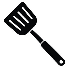 Black spatula with slots is ready for kitchen use to turn food skillfully