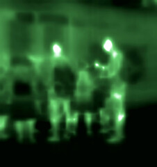 Street traffic. Pedestrians, rush hour. Image thermal imager device Medium infrared spectrum.