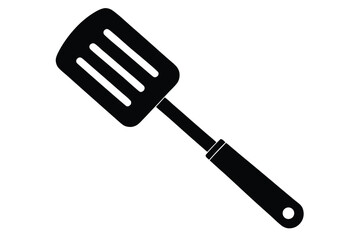A solid black spatula with three slots is seen against a white backdrop