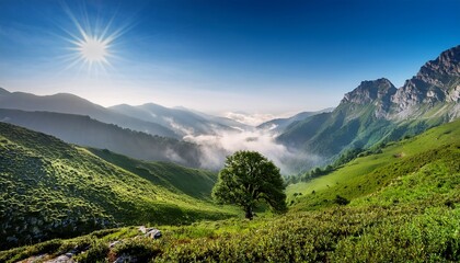 Obraz premium a breathtaking mountain view featuring rugged peaks lush greenery and a lone tree standing majestically amidst the misty atmosphere