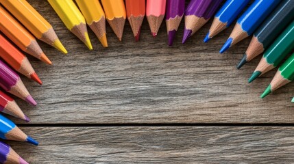 Colorful Pencils Arranged on Wooden Surface Creating a Vibrant Circular Design