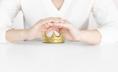 Protective Hands Shielding Golden Crown Representing Leadership and Success