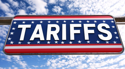 United States Tariffs Sign against a clear blue sky background