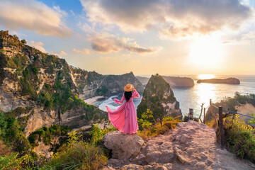 Tourist standing on viewpoint near Diamond beach in Nusa penida island, Indonesia.