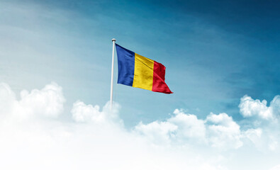 Romania national flag with mast waving in beautiful sky. Romania flag for Republic Day and Independence Day.