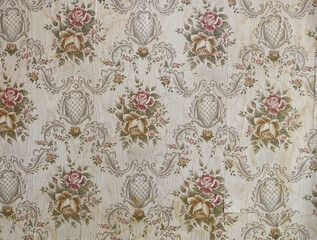 Old wallpaper on the wall. Old wallpaper for texture or background.