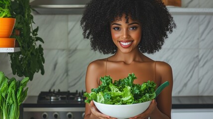 Smiling woman holding bowl of fresh green salad healthy eating concept