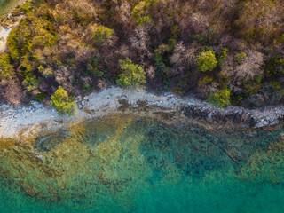 Aerial view white sand rocky beach wave tropical island turquoise water