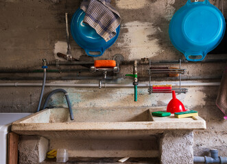 Sink in an old rustic cement wall basement
