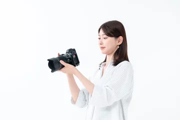 Fotobehang カメラを持つ女性 © naka