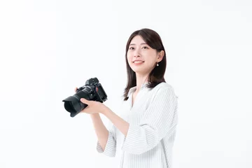 Fotobehang カメラを持つ女性 © naka