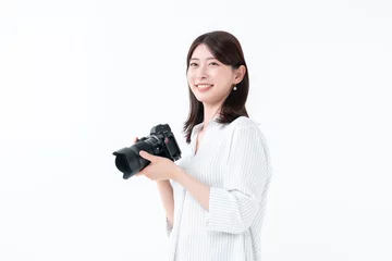 Fotobehang カメラを持つ女性 © naka