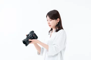 Fotobehang カメラを持つ女性 © naka