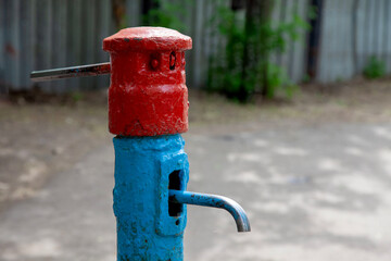 The water pump is outside. Close-up.