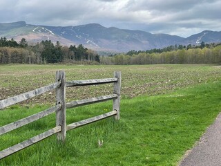 Walking bike path winds through the green countryside, farms, and mountains of Vermont in this picturesque scene