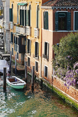 Old houses facades and channel in the old center of Venice, Italy