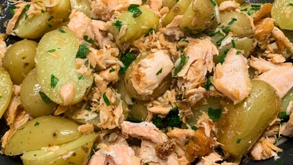 Tender salmon flaked over golden new potatoes, invoking Yule feasts and Cornish maritime folklore...