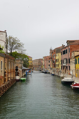 Old houses facades and channel in the old center of Venice, Italy